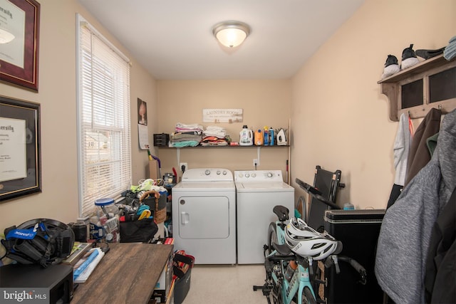 clothes washing area with laundry area and independent washer and dryer