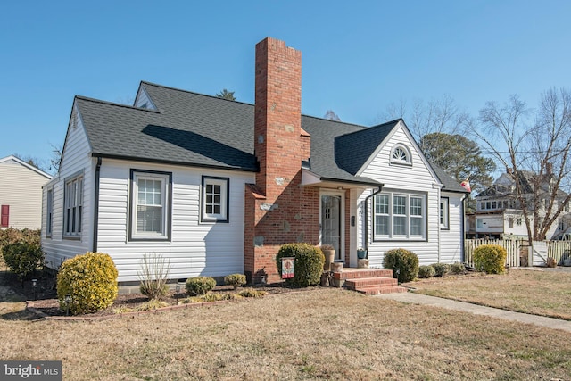 bungalow-style house featuring a chimney, fence, a front lawn, and roof with shingles