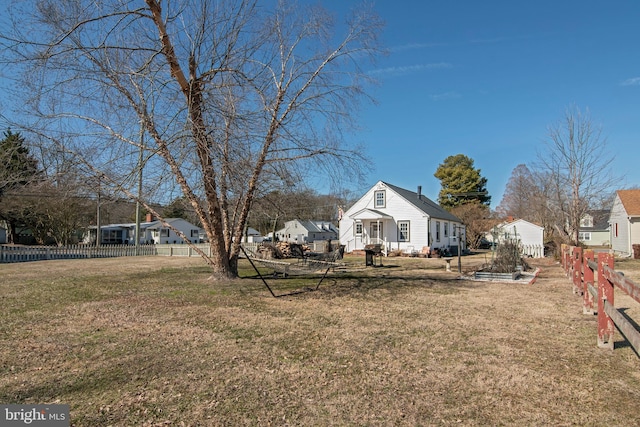 view of yard with a residential view and fence