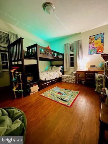 bedroom with wood finished floors