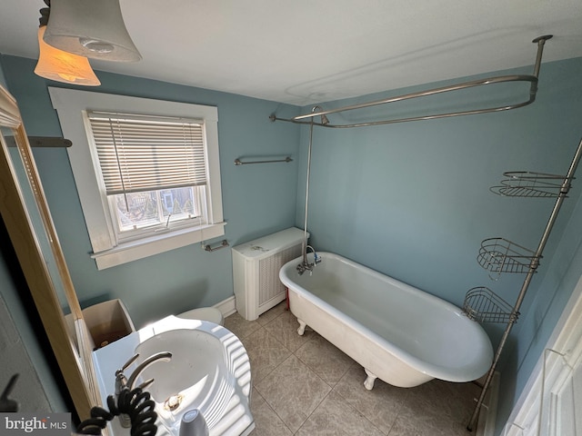 bathroom with a bath, radiator heating unit, tile patterned floors, and toilet