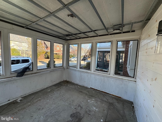 unfurnished sunroom with plenty of natural light