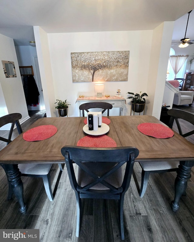 dining room featuring hardwood / wood-style floors and ceiling fan