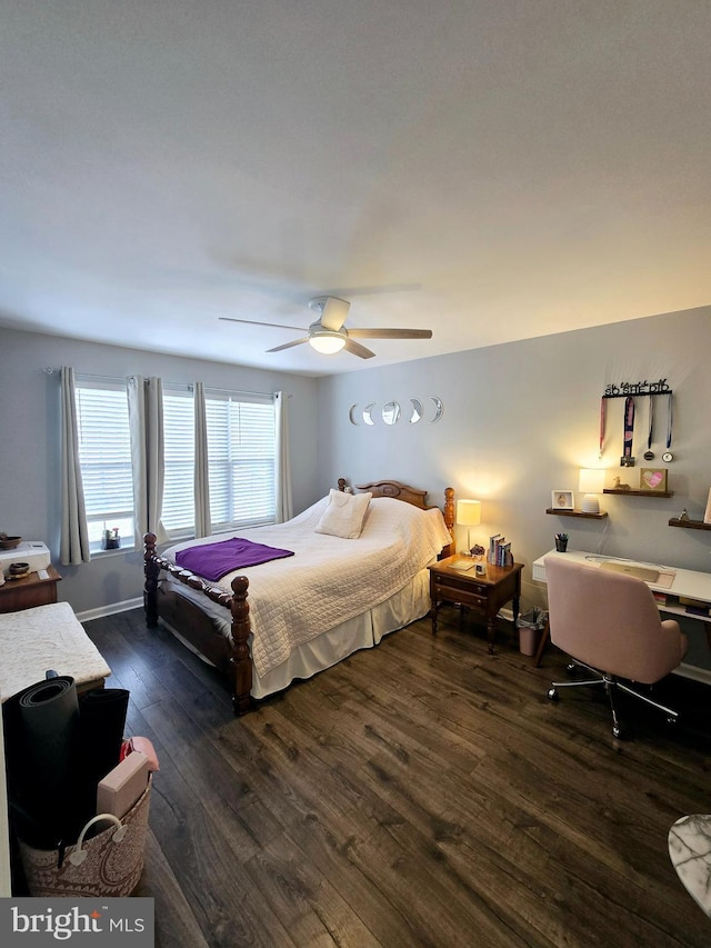 bedroom with ceiling fan and dark hardwood / wood-style flooring