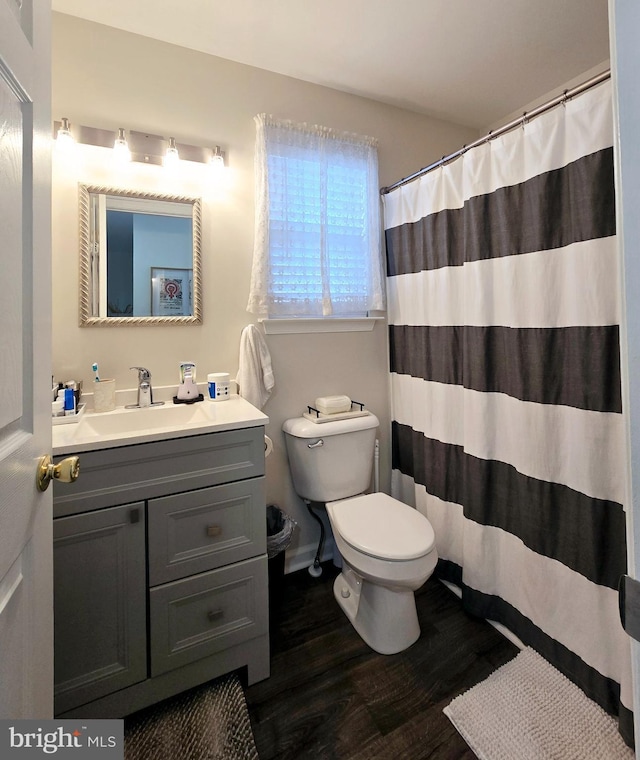 bathroom with vanity, a shower with curtain, wood-type flooring, and toilet