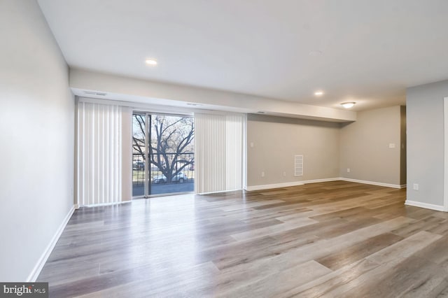 basement featuring light hardwood / wood-style floors