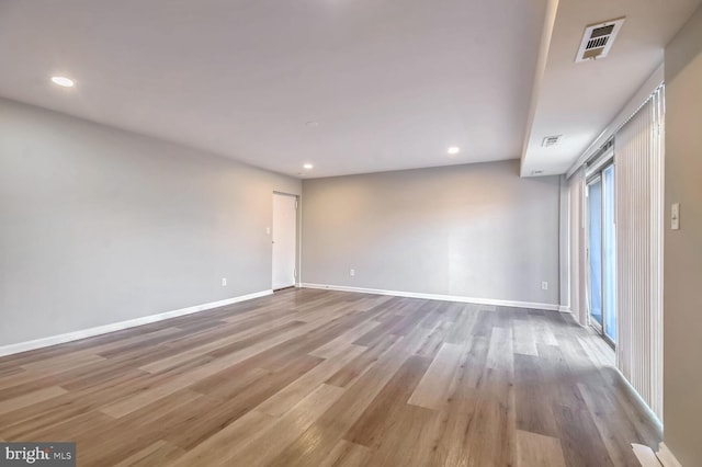 spare room featuring light hardwood / wood-style floors