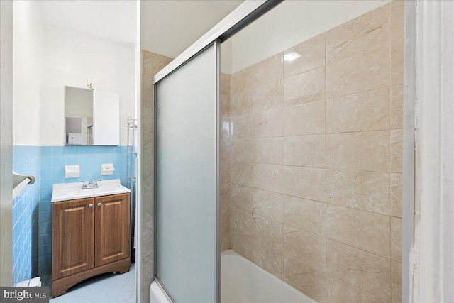 bathroom with tile walls and vanity