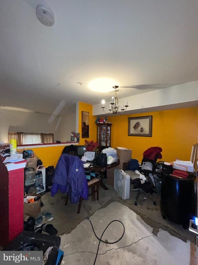 office with concrete floors and a notable chandelier