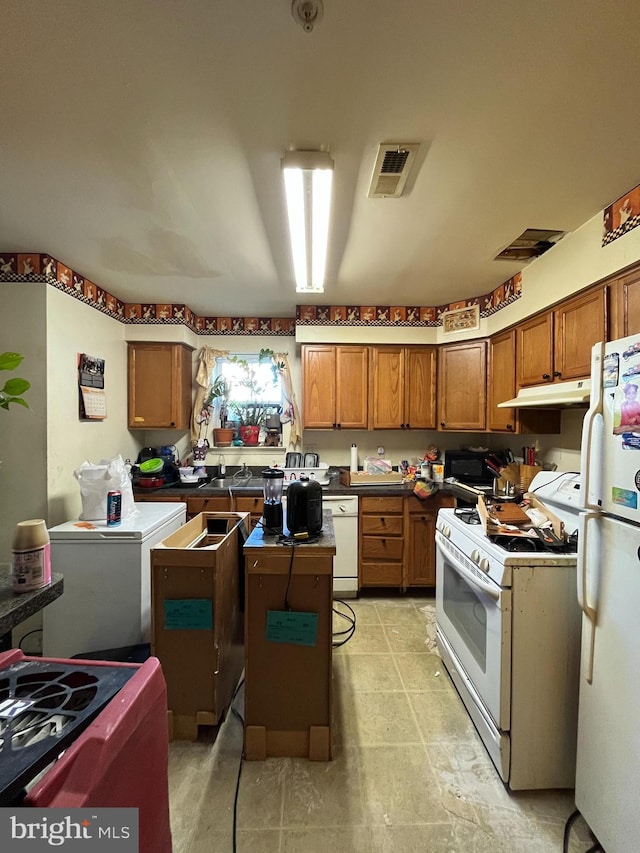 kitchen featuring white appliances and a center island