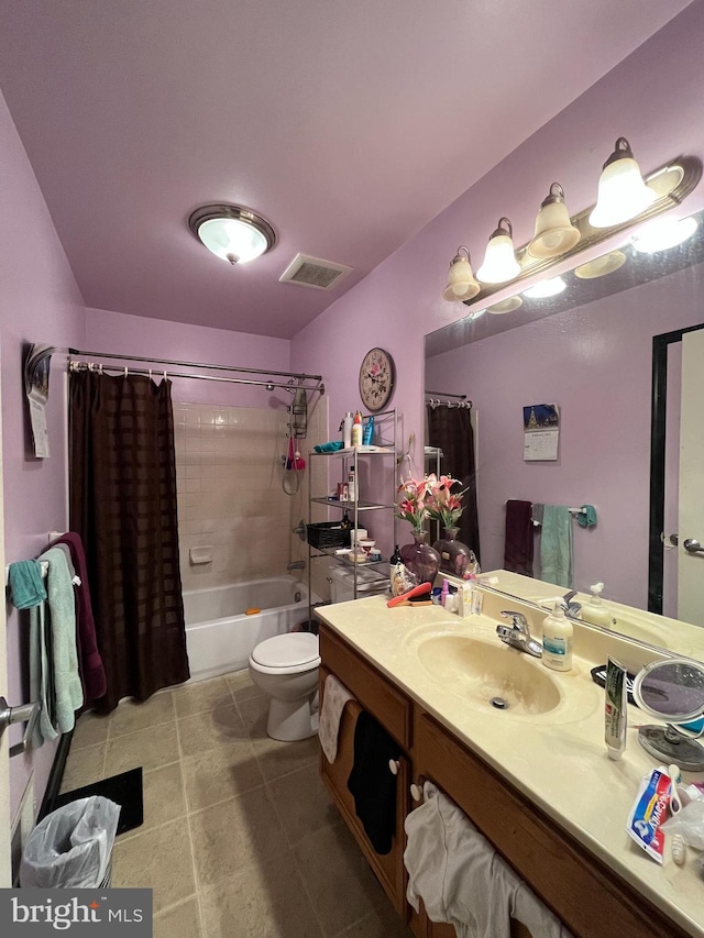 full bathroom featuring shower / bathtub combination with curtain, vanity, tile patterned floors, and toilet