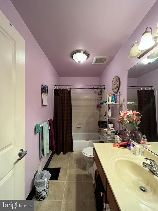 full bathroom with tile patterned flooring, vanity, shower / tub combo with curtain, and toilet