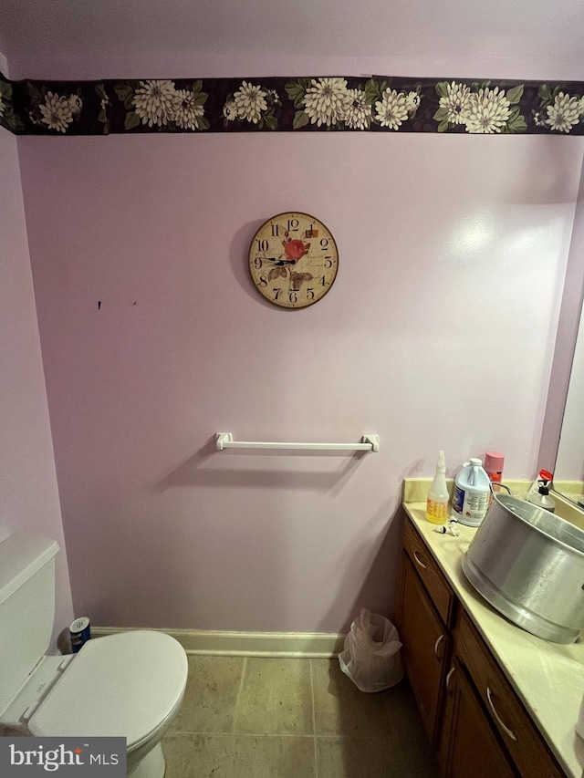 bathroom featuring vanity and toilet