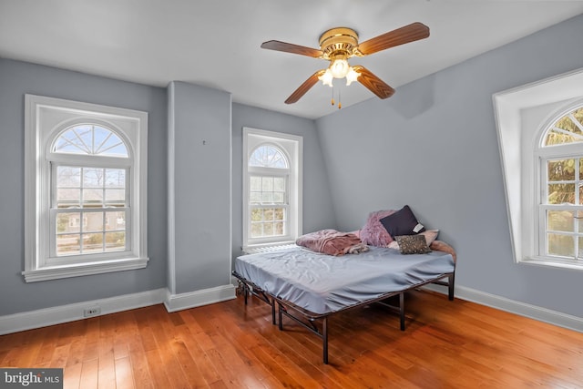 bedroom featuring ceiling fan and light hardwood / wood-style flooring