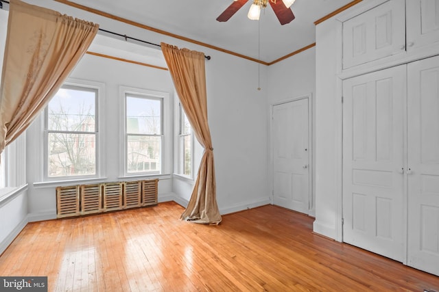 bonus room featuring ceiling fan and light hardwood / wood-style flooring