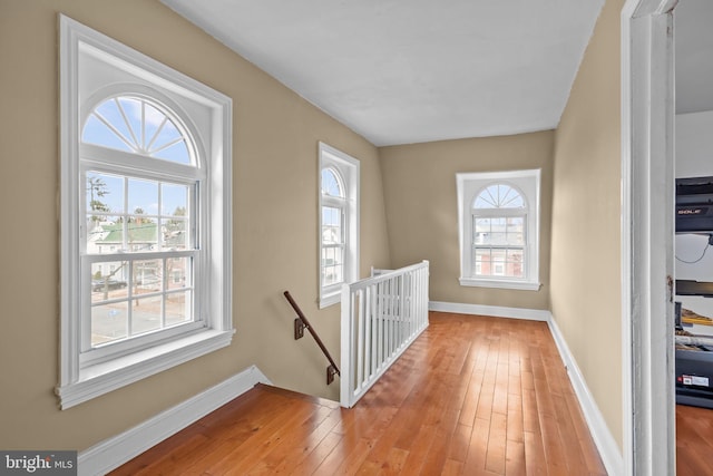 hall with light hardwood / wood-style flooring