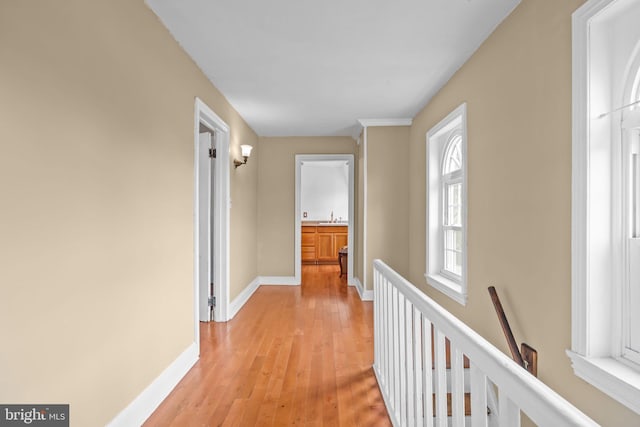 hall featuring sink and light hardwood / wood-style floors