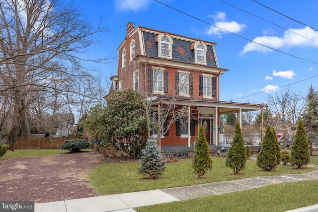 view of front of property with a front lawn and a porch