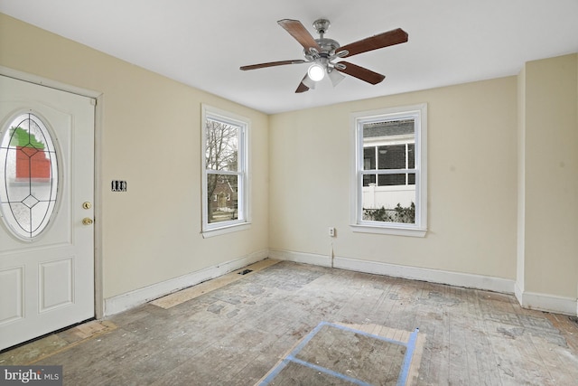 entryway with ceiling fan and light hardwood / wood-style flooring