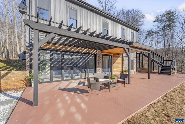 view of patio / terrace with a pergola and outdoor lounge area