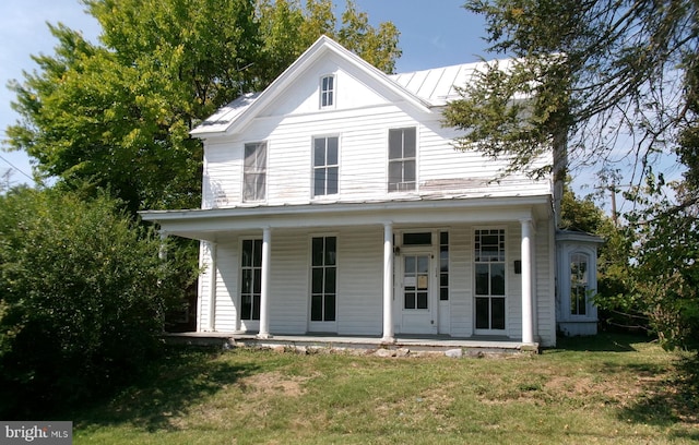 view of front of home featuring a porch and a front lawn