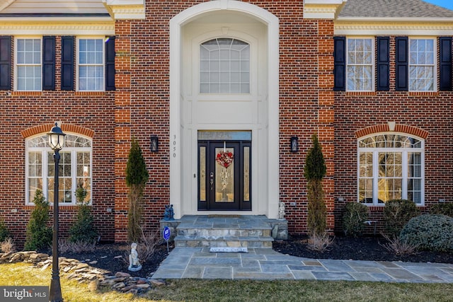 entrance to property with brick siding