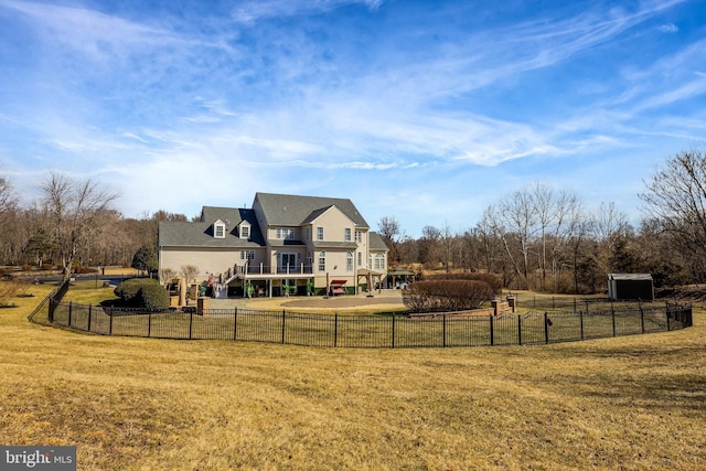 view of yard with fence and stairs