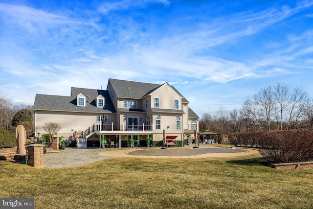 back of property featuring a patio area, stairs, a deck, and a yard