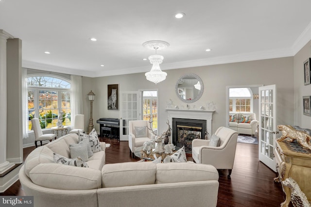 living room with crown molding, a fireplace, dark wood finished floors, and recessed lighting