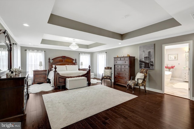 bedroom with a tray ceiling, dark wood-style flooring, crown molding, and baseboards