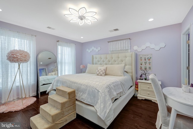 bedroom featuring dark wood-style floors, visible vents, and recessed lighting