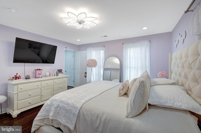 bedroom featuring dark wood-style floors, recessed lighting, visible vents, and baseboards