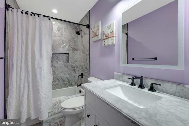 full bathroom with shower / bath combination with curtain, vanity, and toilet