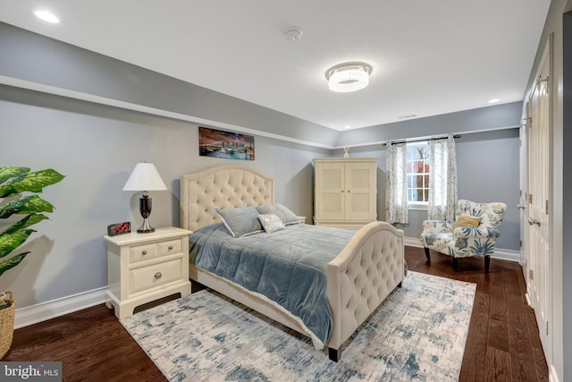 bedroom featuring baseboards, dark wood finished floors, and recessed lighting