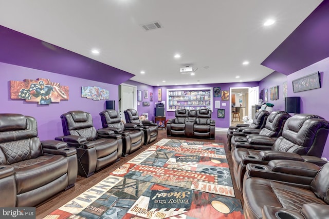 home theater featuring visible vents, wood finished floors, and recessed lighting