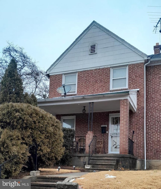 1628 Gleneagle Rd, Baltimore, MD 21239 - view of front of property featuring a porch, brick siding, and a chimney