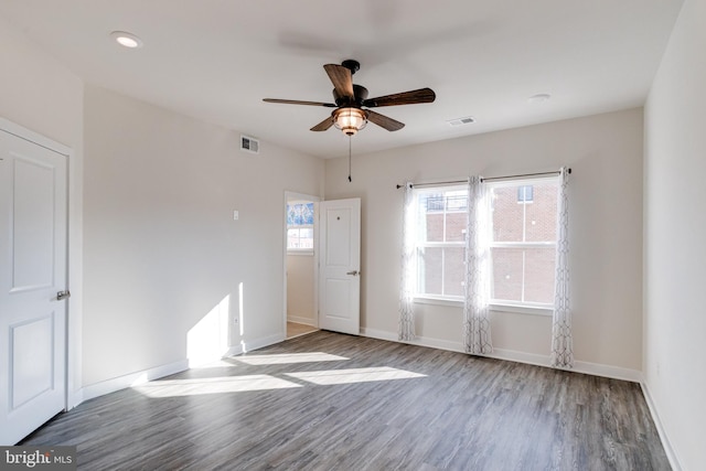 unfurnished room with wood-type flooring and ceiling fan