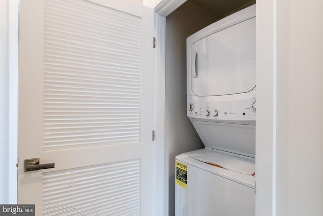 laundry room featuring stacked washer / dryer