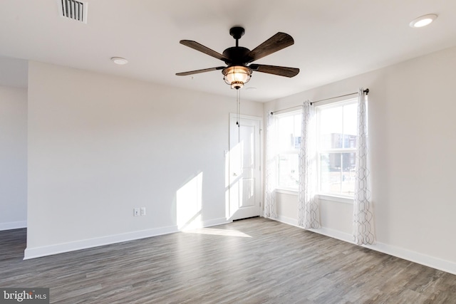 unfurnished room featuring ceiling fan and wood-type flooring