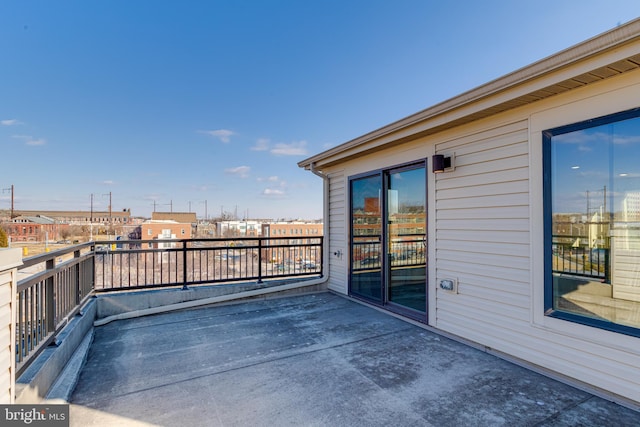 view of patio featuring a balcony