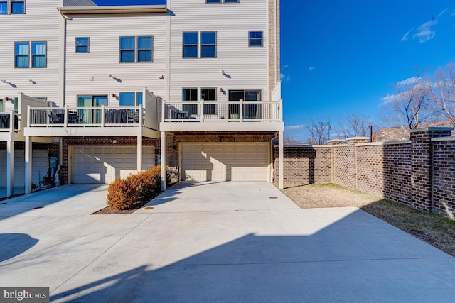 rear view of house with a garage