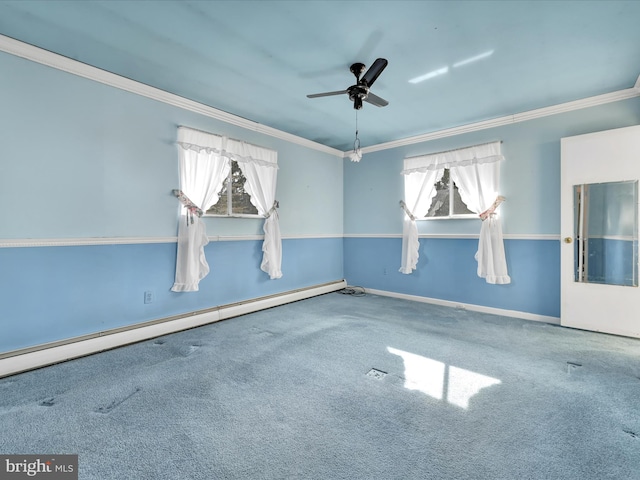 empty room with baseboard heating, ceiling fan, crown molding, and carpet