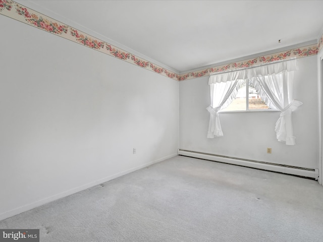 carpeted empty room with a baseboard radiator