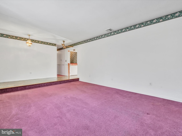 unfurnished room with carpet flooring