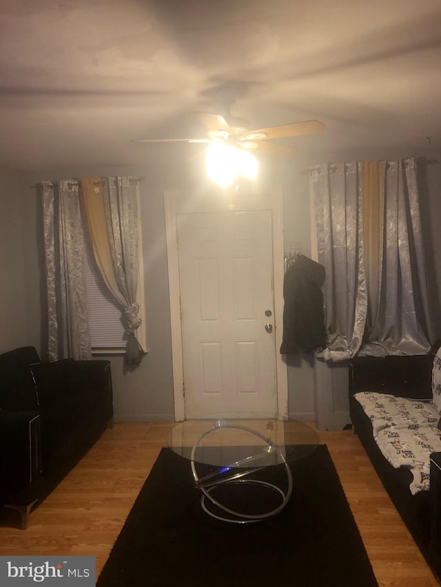 foyer featuring ceiling fan and light hardwood / wood-style floors