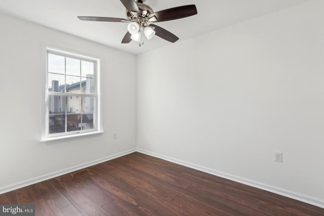 unfurnished room featuring dark hardwood / wood-style floors and ceiling fan