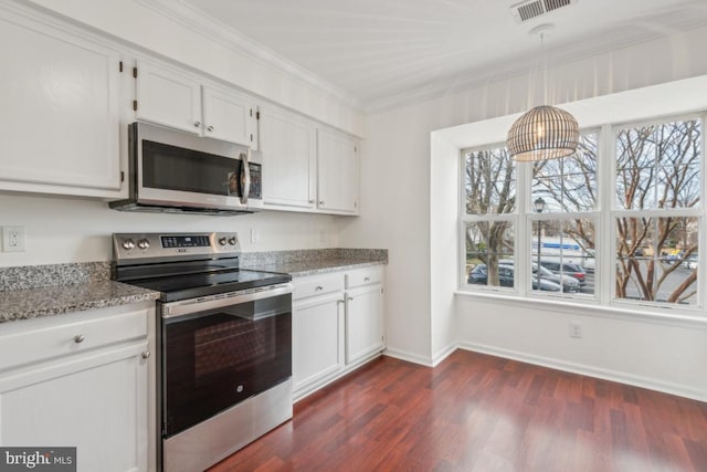 kitchen featuring stainless steel appliances, white cabinetry, pendant lighting, and light stone counters