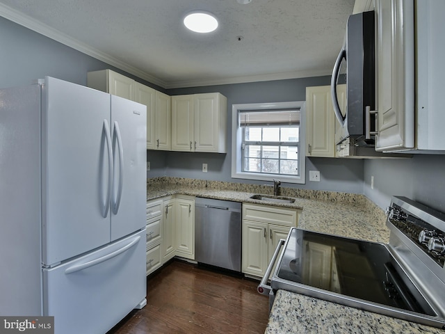 kitchen with sink, ornamental molding, appliances with stainless steel finishes, dark hardwood / wood-style floors, and light stone countertops