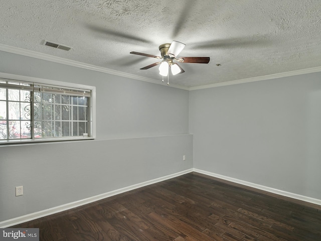 empty room featuring dark hardwood / wood-style flooring, a textured ceiling, ornamental molding, and ceiling fan