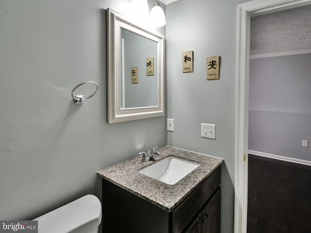 bathroom with vanity and toilet